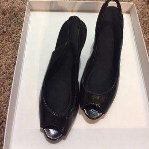 Black paten leather peep toe pumps